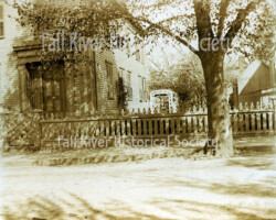 Photograph (ASP10), southwest corner of the Andrew J. Borden residence, 92 Second Street, Fall River, Massachusetts, showing the arbor and the northwest side of Dr. Michael Kelly’s barn, 1892. Albumen print, Arthur S. Phillips, Fall River, Massachusetts.